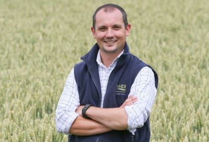 a person smiling in a field